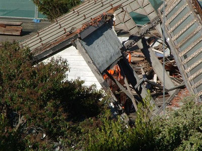 asbestos sheeting being removed from building site